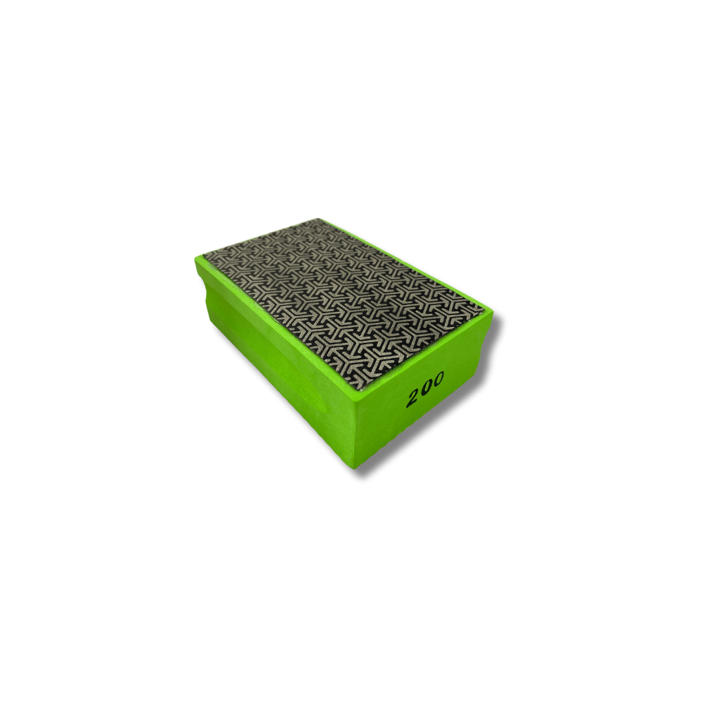 Green foam hand pad with 200 grit diamond abrasive sanding sheet on top.