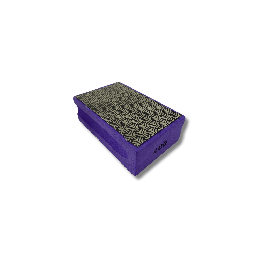 Purple foam hand pad with 400 grit diamond coated abrasive sheet adhered to the top. Diamond hand pad for grinding