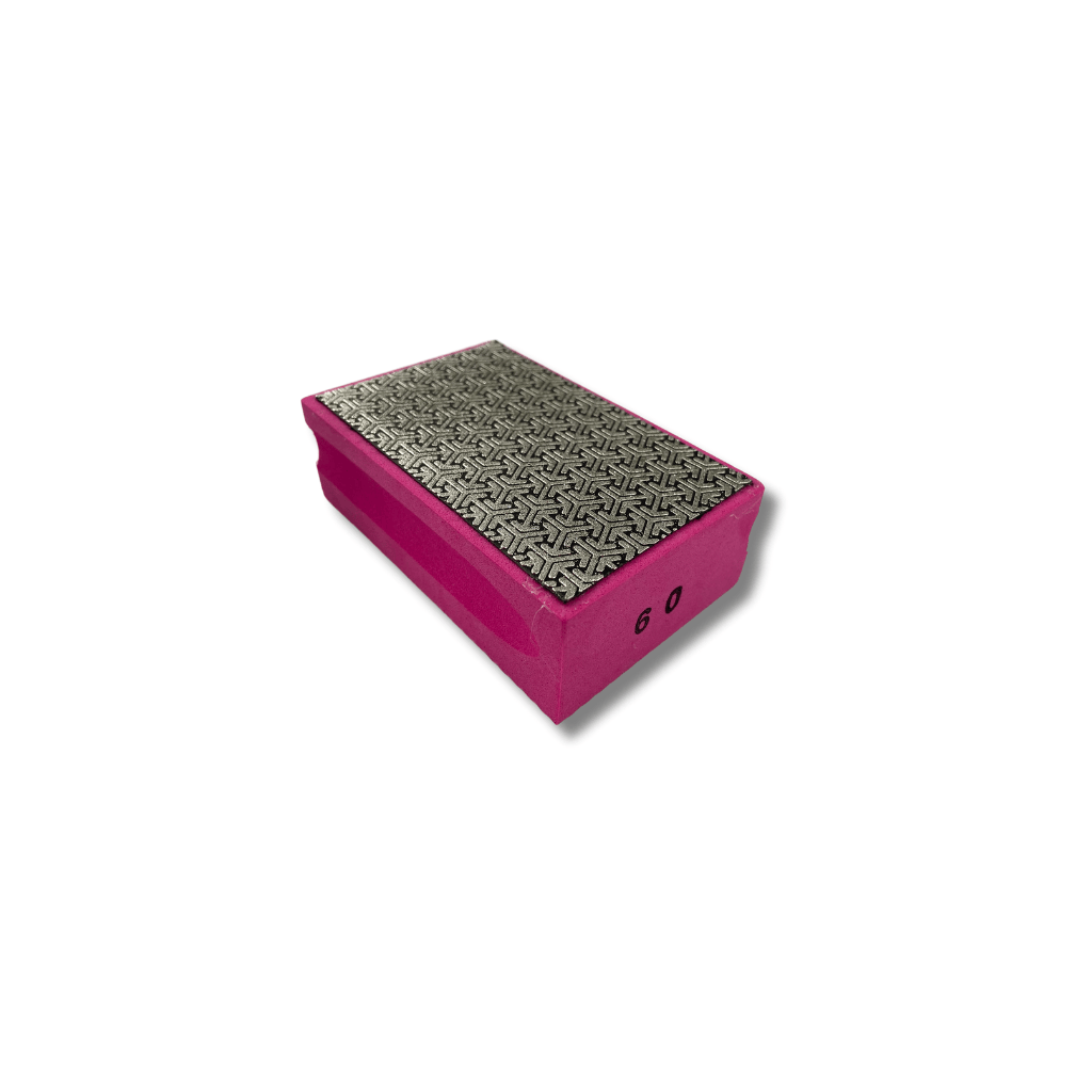Pink diamond hand pad with 60 grit diamond abrasive sanding surface.