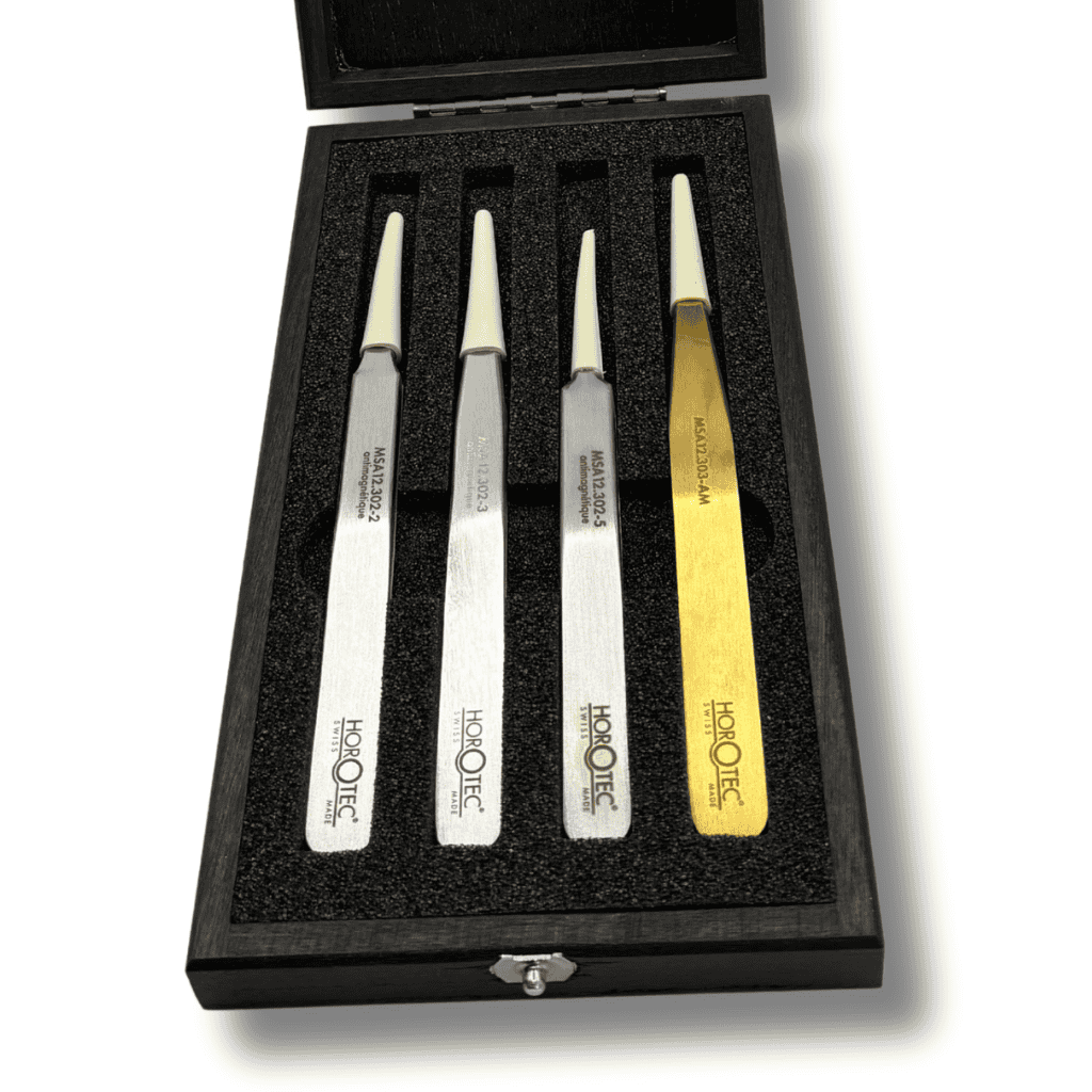 Set of four Horotec tweezers in a wooden balck display box. showing sizes No.2, No.3, No.5 and AM tweezers