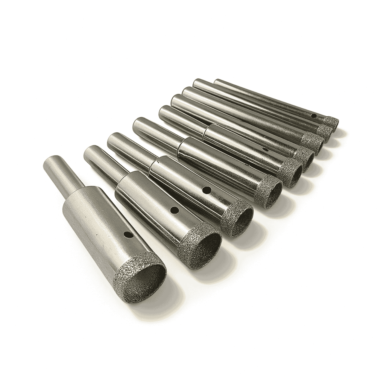 Thin wall diamond core drill bit 4.5–12mm sizes. Display of an assortment of nine Thin wall diamond core drills on a white background