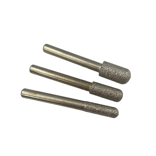 Three vacuum brazed diamond round nose cylinder burrs mounted on a shank, designed for high-performance cutting and shaping operations.