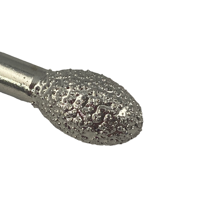close up of the diamond working end of a vacuum brazed egg shaped burr showing the diamond grit in detail