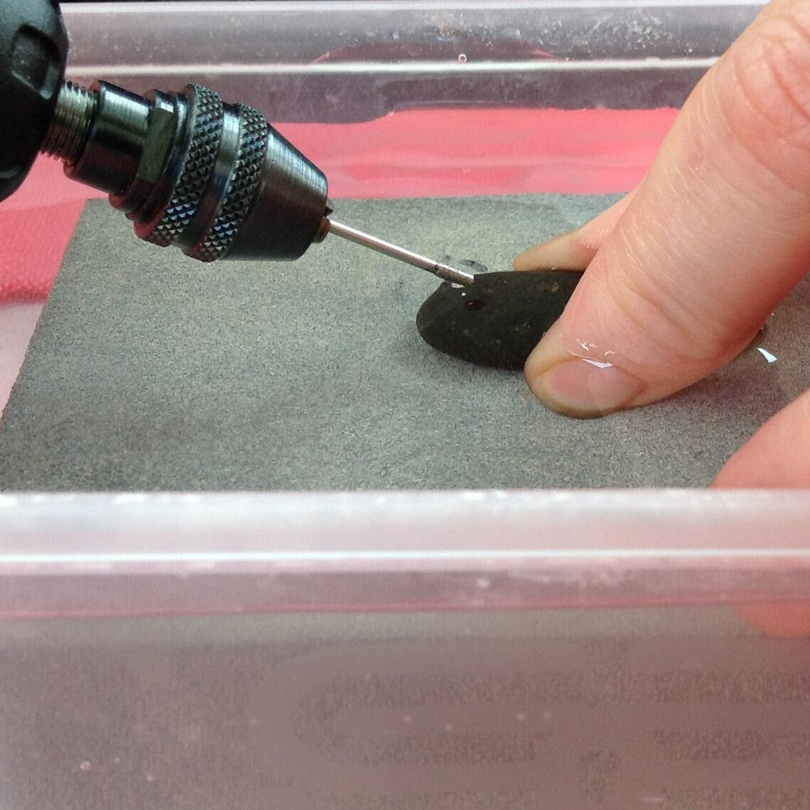 Starting to drill sea glass or stone with Eternal Tools 2mm diamond drill bit under water