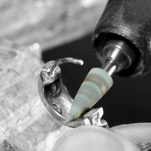Mounted rubber polisher smoothing the inside of a ring