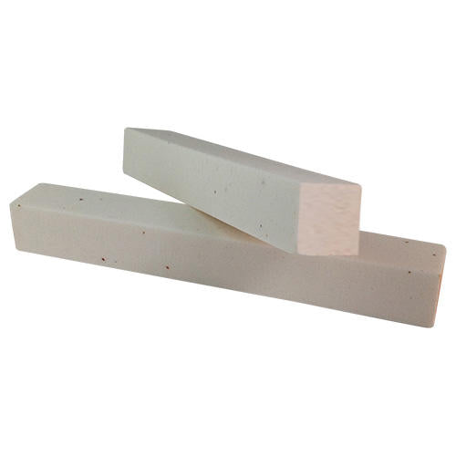 Two White Aluminium Oxide Dressing Stick, one lying on top of the other at an angle. Designed for cleaning ad dressing diamond tools such as files, burrs and wheels