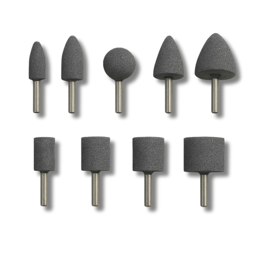 Nine assorted shapes of mounted, grey aluminium oxide corundum grinding stone points on a whote background