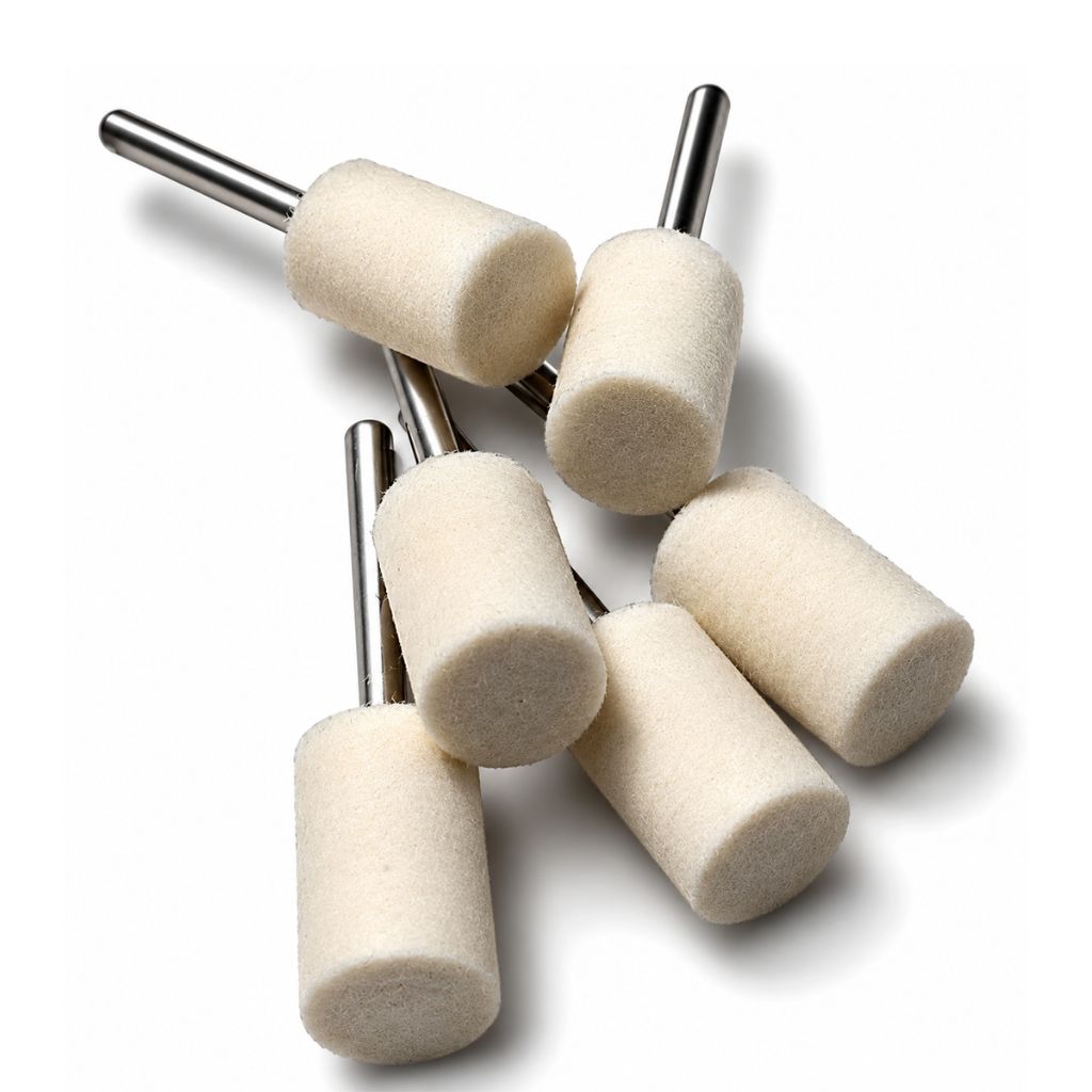 Set of six white cylindrical polishing points 10mm diameter with 3mm steel shanks on a white background