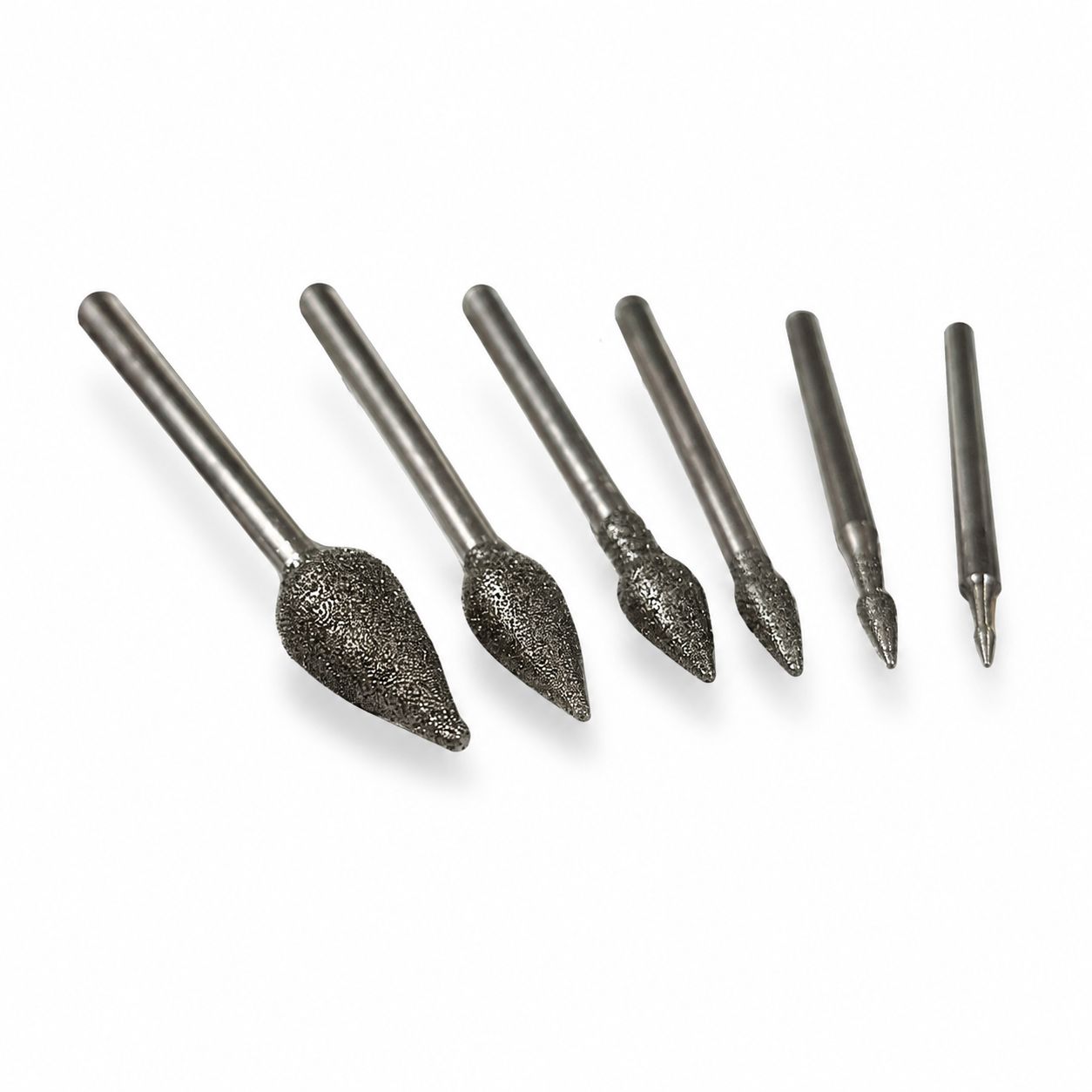 A collection of six teardrop-shaped, diamond-coated burrs for engraving and carving glass and stone. sizes from 1mm to 8mm, with a coarse-medium grit.