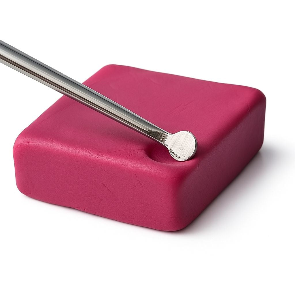 Double Ended Stainless Steel Carving tool on pink modelling clay