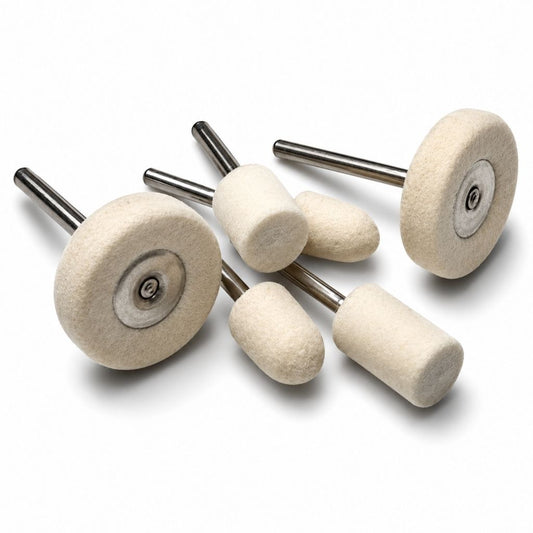 Set of six white polishing wheels, cones and cylinder shaped felt polishers with 3mm metal shanks on a white background